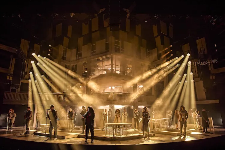 Royal National Theatre London
Standing at the Sky’s Edge

PRODUCTION TEAM:
Music and Lyrics
Richard Hawley

Writer
Chris Bush

Director
Robert Hastie

Set and Costume Designer
Ben Stones 

Choreographer
Lynne Page 

Orchestrator, Arranger and Originating Music Supervisor
Tom Deering 

Lighting Designer
Mark Henderson 

Sound Designer
Bobby Aitken 

Wigs, Hair & Make-up Designer
Cynthia De La Rosa 

Music Director and Associate Music Supervisor
Alex Beetschen 

Casting
Stuart Burt CDG 

Children's Casting
Chloe Blake 

Associate Director
Elin Schofield 

Associate / Resident Choreographer
Thomas Herron 

Associate Costume Designer & Costume Supervisor
Sally Wilson 

Associate Sound Designer

Consulting Music Supervisor
Katy Richardson 

Assistant Music Director
Sam Hall 

Casting Assistant
Peter Noden

Dialect Coach
Shereen Ibrahim 

Dialect Coach
Michaela Kennen 

Wigs, Hair and Make-Up Supervisor
Keisha Banya

Wigs, Hair and Make-Up Supervisor
Suzanne Scotcher

Props Supervisor
Marcus Hall Props

Orchestral Manager
Nicola Rossiter

CAST:
Max/Workman 3
Jonathan Andre 
He/Him

Joy
Elizabeth Ayodele
She/Her

Onstage Swing
Monique Ashe-Palmer
She/Her

Gary/Nigel/Workman 1
Jonathon Bentley
He/Him

Onstage Swing
Adam Colbeck-Dunn
He/Him

Onstage Swing
Viquichele (Vee) Cross  
She/Her

Onstage Swing
Jamie Doncaster
He/Him

Onstage Swing
Caroline Fitzgerald
She/Her 

Jenny
Mya Fox-Scott 
She/Her

Harry
Joel Harper-Jackson
He/Him

Grace/Alice
Sharlene Hector
She/Her

Jimmy
Samuel Jordan 
He/Him

Onstage Swing
Jerome Lincoln 
He/Him

Connie
Mel Lowe 
They/Them

Joe/Workman 2
David McKechnie 
He/Him

Onstage Swing
Sean McLevy 
He/Him

Cathy
Rachael Louise Miller 
She/Her

George
Baker Mukasa 
He/Him

Marcus/Housing Officer
Alastair Natkiel 
He/Him

Poppy
Laura Pitt-Pulford 
She/Her

Charles/Trev/Seb
Adam Price 
He/Him

Nikki
Lauryn Redding 
She/They

Vivienne/Karen
Nicola Sloane 
She/Her

Justine
Lillie-Pearl Wildman 
She/Her

Onstage Swing
Karen Wilkinson 
She/Her

Rose
Rachael Wooding 
She/Her 

YOUNG COMPANY:

TEAM GREEN
Young Connie
Alayna Anderson
She/Her

Young Jimmy
Eric Madgwick
He/Him

TEAM PINK
Young Jimmy
Luca Foster-Lejeune
He/Him

Young Connie
Chioma Nduka
She/Her

TEAM PURPLE
Young Connie
Renée Hart
She/Her

Young Jimmy
Sam Stocks
He/Him

MUSICIANS:

Musical Director / Keys 1
Alex Beetschen 

Assistant Musical Director / Keys 2 / Guitar
Sam Hall 

Lead Guitars
Jon Gingell

Electric & Upright Bass
Phil Donnelly

Drum Kit & Percussion
Darren Beckett

Violin 2 / Viola
Tina Jacobs-Lim

Cello
Gabriella Swallow


2542